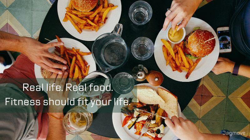 People enjoying burgers and fries as part of a balanced, real life fitness approach without strict dieting