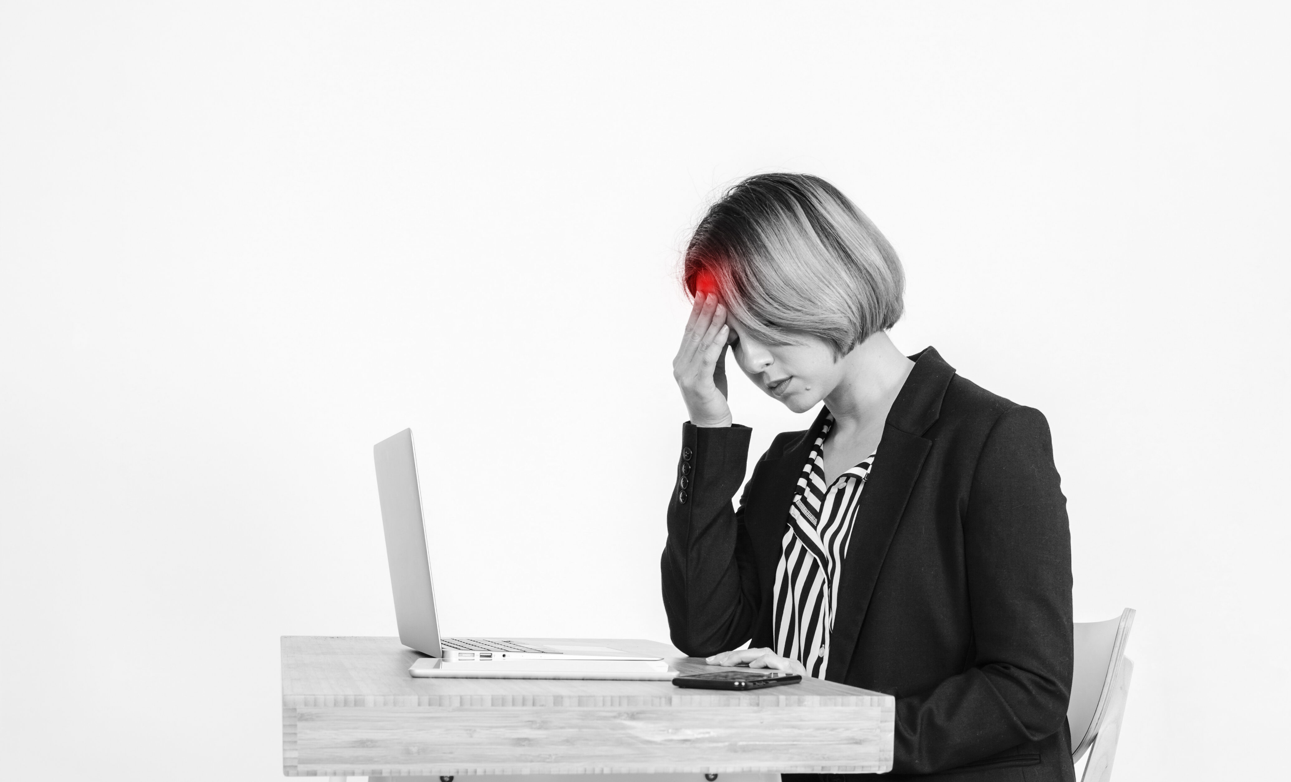 person sitting at a desk all day looking puffy tired and drained with poor posture